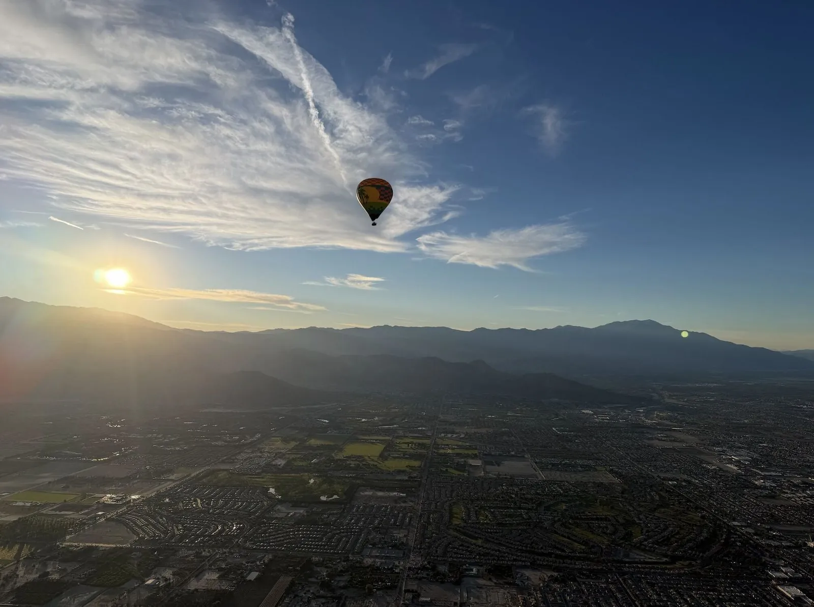 Hot-air balloon over the valley at sunrise