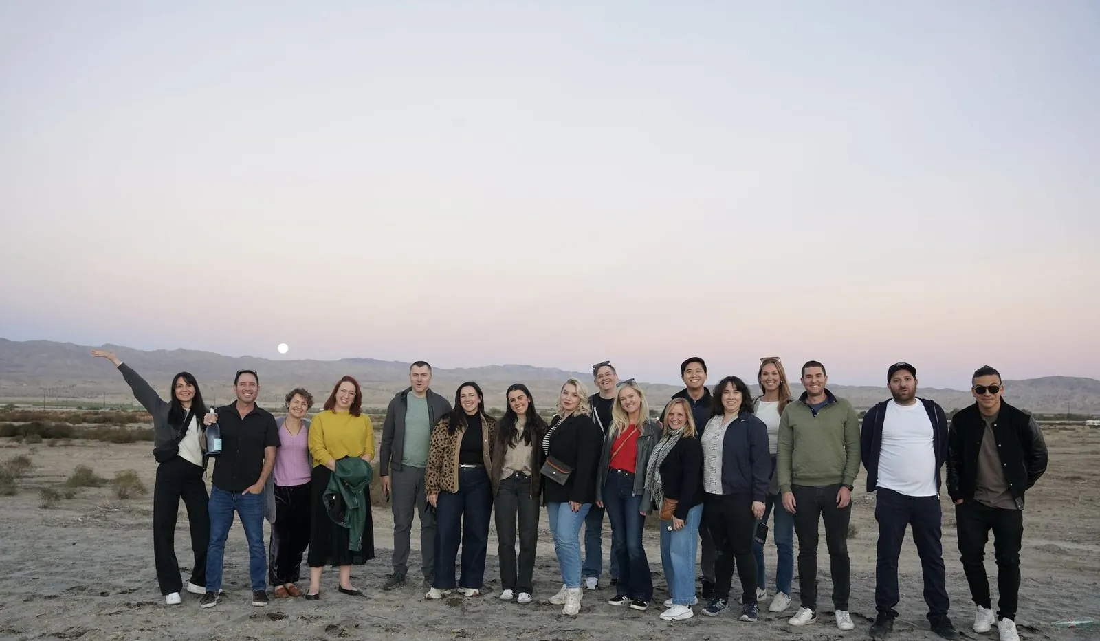 Group photo in the desert at dusk